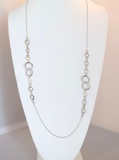 Upgrade your accessory game with our Long Silver Double Circle Necklace. The elegant double circle design adds a modern touch to any outfit. This necklace is durable and timeless. Elevate your style with this versatile piece. Elegant Silver Jewelry With Double Chain, Elegant Metal Double Chain Jewelry, Elegant Metal Jewelry With Double Chain, Elegant Silver Full Circle Necklace, Chic Silver Long Necklace, Elegant Silver Double Chain Necklace, Elegant Open Circle Metal Jewelry, Chic Round Chain Necklace For Formal Occasions, Elegant Infinity Chain Necklace