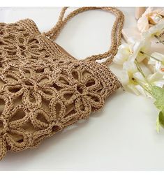 IN STOCK FAST SHIPPING FROM LOS ANGELES Artfully designed for your summertime getaways, the Elena Handbags Floral Design Straw Beach Tote adds a touch of charm and elegance to any beachwear ensemble. Crafted from lightweight straw and woven with intricate floral designs, this bag is the perfect companion for yoga, the market place, and, of course, the beach. Elegant and tasteful, this sophisticated tote is sure to turn heads. Size is approximately 28cm wide x 25cm tall (11in x 10in) Designer Sty Straw Beach Tote, Artfully Designed, Beach Tote, Market Place, Long Handles, Floral Designs, Beach Bag, Straw, Floral Design