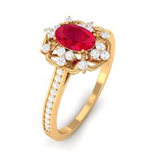 a gold ring with a red stone surrounded by white stones and diamonds on the sides