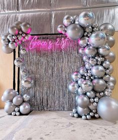 an arch made out of balloons and streamers