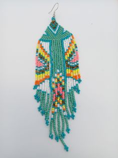 "Desert Blues Native American Style Seed Bead Earrings Hand Made Ethnic Earrings Free Shipping with Native Colors and Design. Amazing Native American Style Seed Bead Earrings with a variety of native colors in a traditional design. Made with Stainless steel ear wires and genuine high quality beads. A beautiful combination of colors and native design at a super price. At over 6\" long these are Great for matching regalia or to wear on its own. All handmade. Shipped Free from Hawaii with Aloha" Native American Style, Seed Bead Patterns, Native Design, Ethnic Earrings, Native American Fashion, Bead Patterns, Seed Bead Earrings, Bead Earrings, Seed Bead