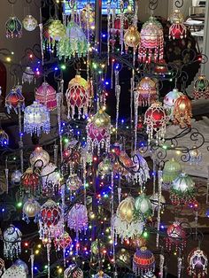 an assortment of colorful lights and ornaments on display