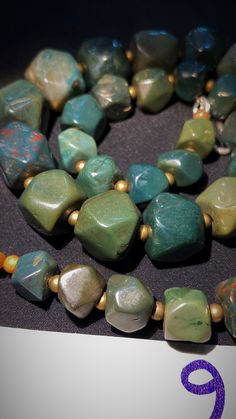 antiques beads of green jade or aventurine jade very good condition and very rare from south asia mostly found in india and pakistan and afghanistan region .the shape of beads is unique as you can see in the pictures . the beads are old around 400 to 700 years or more Green Bohemian Faceted Beads, Gems And Cabochons, Unique Jade Beaded Necklace With Round Beads, Emerald Necklace With Aventurine Gemstone Beads, Emerald Necklace With Round Aventurine Gemstone Beads, Large Jade Beads For Jewelry Making, Polished Aventurine Bead Necklace, Aventurine Polished Round Bead Necklaces, Aventurine Polished Round Beads Necklace, Jade Beaded Necklaces With Natural Stones For Jewelry Making