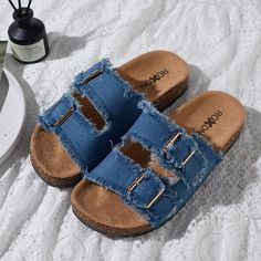 Step into comfort and style with the Roxoni Women's Comfort Flat Sandals. These sandals are designed to provide all-day ease with a chic touch, perfect for any casual outing.

- **Size**: 8
- **Color**: Blue
- **Material**: Suede
- **Gender**: Female
- **Features**: Double buckle adjustable straps, EVA flat-slide footbed, open toe design with straps and fringes

Crafted with a soft suede material that feels gentle against the skin, these sandals feature an adjustable double-buckle design that al Casual Flat Slippers With Buckle Closure, Trendy Beach Slip-on Footbed Sandals, Trendy Slip-on Footbed Sandals For Beach, Vacation Slippers With Buckle Closure, Comfortable Slippers With Buckle Closure For Vacation, Blue Slippers For Spring Vacation, Casual Flat Sandals With Buckle Closure, Beach Slip-on Footbed Sandals With Buckle Closure, Beach Buckle Closure Slip-on Footbed Sandals