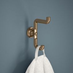 a towel hanging on a hook in a bathroom