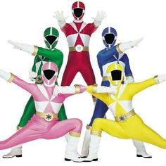 four people in colorful costumes are posing for the camera