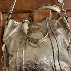 Beautiful Coach Purse Metallic Gold In Perfect Condition Inside & Outside! 2 Handles New Coach Handbags, Burgundy Purse, Small Shoulder Bags, Coach Tote Bags, Leather Satchel Handbags, Vintage Shoulder Bag, Coach Shoulder Bag, Black Shoulder Bag, Large Shoulder Bags