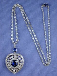 Edwardian Vintage Genuine diamond blue sapphire long chain heart necklace in sterling silver for women  Metal Purity:925 ⁵ Metal weight: 90.00 gram Stone : Rose cut diamond Stone  Clarity: SI1-SI2 stone Ctw: 20..90ctw Gemstone: Blue sapphire  Gemstone creation: lab created  Item length: 20. 00 inch Item finished in 18k white gold plated on silver Elegant Blue Necklace With Single Cut Diamonds, Luxury Heart-shaped Sapphire Jewelry, Formal Sapphire Heart Necklace, Elegant Sapphire Pear-shaped Necklace, Heart-shaped Sapphire Jewelry For Formal Occasions, Elegant Pear-shaped Sapphire Necklace, Elegant Rose Cut Heart Shaped Diamond Jewelry, Formal Sapphire Heart Pendant Jewelry, Fine Jewelry Sapphire Heart Pendant