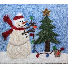 a snowman and christmas tree hooked up to a hook on a blue door mat