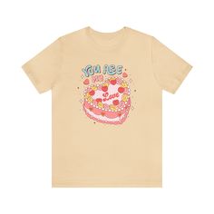 This charming tee takes inspiration from the past, featuring a delightful retro cake design and a sweet message that's perfect for expressing affection. Whether you're enjoying a romantic date or simply spreading love vibes wherever you go, this tee is a delightful addition to your Valentine's Day wardrobe. The retro charm and sweet message make it a versatile piece that can be worn with jeans, skirts, or your favorite cozy loungewear. T-Shirt Material + Fit - 100% Airlume combed and ring-spun c Valentine Graphic Tee, Retro Cake Design, Cake Graphic, Retro Cake, Shirt Cake, Love Vibes, Retro Love, Sweet Message, Valentines Day Cakes