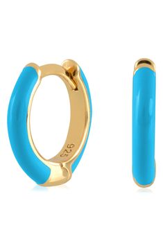 Easy-to-wear hoop earrings will add significant polish to even your most casual ensembles. 1/2" drop; 1/8" width Hinge with snap-post closure Sterling silver with goldtone plate/enamel Imported Blue Small Hoop Huggie Earrings, Blue Hypoallergenic Small Hoop Huggie Earrings, Hypoallergenic Blue Small Hoop Huggie Earrings, Trendy Blue Enamel Jewelry, Blue Small Hoop Huggie Earrings For Everyday, Blue Huggie Hoop Earrings For Pierced Ears, Blue Huggie Hoop Earrings For Everyday, Everyday Blue Huggie Hoop Earrings, Trendy Small Blue Hoop Earrings