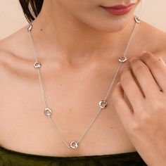 Complete your look with this classic station necklace. Circular stations at equidistance are studded with baguette-cut white zircons, with another side of plated silver. Adjustable in sizes 18, 24, and 30 inches, it can be worn in multiple ways by layering necklaces in various styles. Made in sterling silver Secured with lobster clasp Adjustable length - 18, 24, and 30 inches Pearl Birthstone, Layering Necklaces, Gold Vermeil Jewelry, Stacked Earrings, Vermeil Jewelry, Charm Rings, Station Necklace, Pearl Gemstone, Engraved Necklace