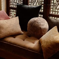 a couch with several pillows on top of it