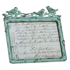 a blue frame with two birds on it and writing in the bottom right hand corner