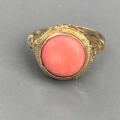 We take pride in finding unique , quality ~ Antique /Vintage jewelry pieces which are carefully hand picked by us so that you can add them to your treasure/ collection or gift to someone you love ~ We try to add plenty of items every week and have been selling online for more then 10 years . Vintage Art Deco ~ 14kt solid gold ~ filigree ring with ta large geuine coral can which is set on an open-back frame . Marked 14kt (also acid tested ) Dates 1920's -1930's Measurements : Ring can fit 6 1/2 - Filigree Ring Gold, Antique Vintage Jewelry, Coral Ring, Gold Filigree, Filigree Ring, Victorian Jewelry, Sterling Silver Hoops, 14kt Gold, Silver Hoop Earrings