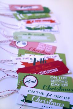 several christmas gift tags are lined up on a table