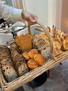 a basket filled with lots of different types of bread