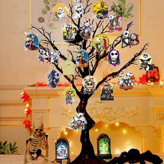 a tree that has been decorated with pictures and skeleton figurines on it in front of a fireplace