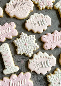 decorated cookies with frosting on top of a table next to each other and the words winter one third written in white icing