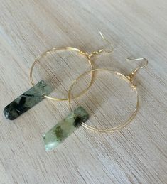 These are beautiful, earthy, minimalistic crystal hoops made from natural citrine or natural green agate and high quality tarnish resistant wire. Each hoop is hand wrapped with a single piece of wire with a natural Citrine or Green Agate Crystal added which makes every pair one of a kind and unique.  Ear hooks are gold plated. Size and shape of crystals will be unique to each pair of earrings. Minimalist Gemstone Hoop Jewelry, Minimalist Everyday Hoop Earrings With Natural Stones, Everyday Minimalist Hoop Earrings With Natural Stones, Minimalist Wire Wrapped Hoop Jewelry, Minimalist Natural Stone Earrings, Minimalist Green Agate Jewelry, Minimalist Wire Wrapped Hoop Earrings, Round Agate Ear Wire Jewelry, Minimalist Wire Wrapped Round Hoop Earrings