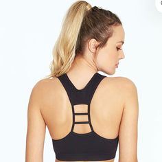 Textured But Seamless, This Low-Impact Sports Bra With Removable Cup Pads Will Give You The Flexibility You Need In Your Yoga Session, As Well As Stylish Ribbed Trim And A Ladder-Cutout Racerback! 93% Polyester/7% Nylon 1 1/4" Wide Underband Weave In Pattern Low Impact Scoopneck With Strap Detail At Racerback Removable Cup Pads, Non-Adjustable Straps Dry-Wik Moisture Performance Machine Wash Athleisure T-back Sports Bra With Seamless Construction, Black Sports Bra With Built-in Bra And Medium Support, Black Seamless Athleisure Tank Top, Functional Black Tank Top With Seamless Construction, Black Sporty T-back Activewear, Black Sports Bra With Built-in Bra For Yoga, Black Seamless Tank Top For Athleisure, Black Seamless Tank Top For Workout, Seamless T-back Activewear For Workout