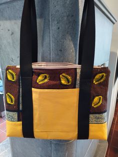 Stitched with attention to detail, this bag is made of two fabrics. The corn-yellow lower side is made of imitation leather, therefore very stable, the brown-coloured fabric is made of cotton and has been reinforced with fleece. On the front is a pocket, which can be closed with a Velcro. The lining is beige with a small pattern, also made of cotton fabric.  At the top is a beiger zipper sewn in. The straps are completely sewn around the bag and not only give the bag a great design but also make Casual Brown Bags With Zipper Pocket, Brown Pouch Shoulder Bag With Zipper Closure, Brown Zipper Pouch Shoulder Bag, Fabric Backpack For Daily Use, Brown School Shoulder Canvas Bag, Brown Shoulder Bag With Zipper Pocket For School, Everyday Fabric Backpack, Brown On-the-go Shoulder Bag With Pockets, Brown Shoulder Bag With Zipper Pocket