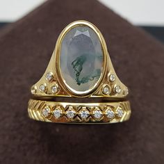 Moss Agate Oval Gemstone Ring | Wedding Couple Rings for Spring | Green House Design Gold Ring | Victorian Green Moss Stack Rings For Women Moss Agate Rings are gorgeous pop of color and unique one of a kind style rings. No two gemstones are same and is unique as yourself. Also these are pocket friendly than diamonds and encourage tranquility & emotional balance.  Detailed Description ------------------------------ Total ring 💍: 2 Total Diamonds 💎 : 16 Pcs Ring Specifications:  Gemstone Shape - Kite   💎 Weight & Size - 2.3 Ct - 12.20X8.20X4.30 MM (1 Pcs)  Diamond Shape - Round   💎 Weight & Size - 0.1 Ct - 1.30 MM (15 Pcs)   💎 Total Gemstones Weight - 2.41 Ct   💍  Total Weight of the Ring - 5.618 ◾ Type - Natural Diamond ◾ Clarity - VS-GH ◾ Luster - Excellent ◾ Make - High Quality ◾ T Oval Emerald Ring With Rose Cut Diamonds For Wedding, Oval Gemstone Gold Stackable Rings, Heirloom Emerald Ring With Gemstone Accents, Oval Cabochon Emerald Ring With Bezel Setting For Weddings, Heirloom Emerald Ring With Oval Gemstone Accents, Oval Gold Emerald Ring With Rose Cut Diamonds, Heirloom Oval Emerald Ring With Gemstone Accents, Oval Emerald Ring With Rose Cut Diamonds In Gold, Yellow Gold Agate Rings With Gemstone