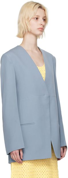 Wool gabardine blazer. · Paneled construction · Y-neck · Button closure · Welt pockets · Padded shoulders · Strap at back · Central vent at back hem · Welt pockets at interior · Full viscose twill lining · Horn hardware Supplier color: French blue Spring Structured Outerwear With Pressed Crease, Semi-formal Spring Outerwear With V-neck, Spring Blazer With Structured Shoulders, Spring Formal Blazer With Concealed Fastening, V-neck Outerwear With Hidden Button Closure For Work, V-neck Outerwear For Business In Spring, Spring Semi-formal Outerwear With Structured Shoulders, Tailored Spring Blazer With Concealed Front Fastening, Spring Outerwear With Concealed Placket And Notched Shape