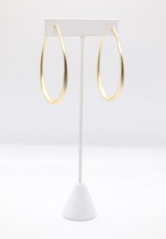 Matte gold teardrop earrings feature a sleek and smooth finish with a subtle sheen, providing a sophisticated yet understated elegance. Their teardrop shape offers a classic and timeless design, making them versatile for both casual and formal occasions. Chic Teardrop Earrings For Formal Occasions, Formal Teardrop Hoop Earrings, Formal Minimalist Long Drop Teardrop Earrings, Minimalist Long Drop Teardrop Earrings For Formal Occasions, Minimalist Gold Teardrop Earrings For Formal, Gold Minimalist Teardrop Earrings For Formal Occasions, Gold Minimalist Teardrop Earrings For Formal Events, Minimalist Gold Teardrop Earrings For Formal Occasions, Minimalist Formal Teardrop Earrings