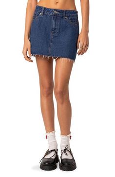 This cute miniskirt is made with nonstretch denim and designed with a raw hem for authentic vibes. Zip fly with button closure Coin pockets; front slant pockets; back patch pockets 100% cotton Machine wash, line dry Imported Dark Wash Mini Length Shorts For Spring, Cotton Denim Mini Skirt With Frayed Hem, Spring Dark Wash Mini Shorts, Medium Wash Mini Cotton Skort, Medium Wash Cotton Mini Denim Skirt, Medium Wash Cotton Mini Skirt, Denim Blue Cotton Cutoff Mini Skirt, Cotton Mini Skirt In Medium Wash, Mid-rise Cotton Denim Skirt With Frayed Hem