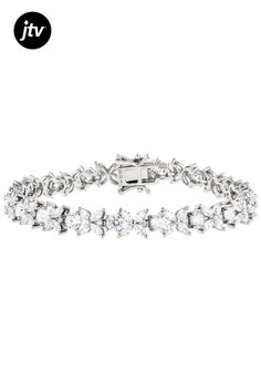 Bella Luce�� white diamond simulant 15.86ctw round and marquise, platinum over sterling silver tennis bracelet. Measures approximately 7.25"-8" L x 0.25" W and has a hidden box clasp closure. Diamond equivalent weight is 9.61ctw. Silver Tennis Bracelet, Diamond Simulant, Box Clasp, Tennis Bracelet, White Diamond, Cubic Zirconia, Platinum, Tennis, Bracelet