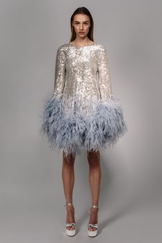 a stretch sequin cut mini dress with ostrich plumes that increase in volume as they move down the dress and sleeves   Fit: Nina is 5ft 10'' and wears a size 0 Composition: 90% polyester/10% elastane, 100% natural ostrich feathers Made in: India Feather Dress Short, Christmas Party Dresses, Feather Fashion, Christmas Outfit Ideas, Funky Dresses, Derby Dress, Outfits Dress, Disco Dress, Theme Dress