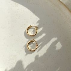 If you're the type of person who relies on staples for everyday wear, snag these classic hoops that will last, wear after wear. An elevated version of our gold fill hoops with an endless snap closure. Sold as a pair. Each purchase comes with an elegant, vegan leather box for storing + caring for your jewelry. DETAILS14k Solid Gold | 15mm hoops Classic Everyday Hoop Earrings In Recycled Gold, Everyday Recycled Gold Huggie Earrings, Simple 14k Gold Huggie Earrings For Everyday, Simple Everyday 14k Gold Huggie Earrings, Everyday Simple 14k Gold Huggie Earrings, Classic 14k Gold Filled Hoop Earrings For Everyday Luxury, Everyday Round Huggie Earrings In Recycled Gold, Classic Everyday Huggie Earrings With Lever Back, Classic Huggie Earrings With Lever Back For Everyday