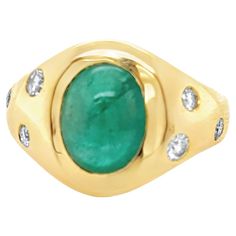 Beautiful Oval Cabochon Emerald & Diamond Cocktail Ring features a 3.42 carats Natural Beryl Oval Vivid Green Zambian Cabochon Emerald with 7 Round Brilliant shape Diamonds set in 18k Yellow Gold. Total diamond weight is 0.39 carats. Ring size is 6 . Ring weighs 10.33 grams. 18k Yellow Gold. Ring Size: 6 Metal: 18K gold Primary Stone: Emerald Stone Cut: Cabochon Weight: 3.42 carats Lab Report :GFCO Origin : Zambia Side Stones : Natural Diamonds Weight : 0.39 carats Cutting: Round Brilliant Color Lab Report, Diamond Cocktail Ring, Emerald Diamond Ring, Diamond Cocktail Rings, 18k Yellow Gold Ring, Emerald Stone, Pink Ring, Yellow Gold Ring, Stone Cuts