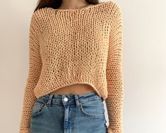 "Hand knit cotton sweater Color on the photo : PEACH Size on the photo: S ✔️55 % cotton  ✔️45 % acrylic  READY TO SHIP Measurements are various for every size because sweater is loose but anyway the top look oversized.  See size chart in the photo Dimensions for S size: Length - 44 cm. / 14.9\" Width - 50-55 cm. / 19.6\"-21.6\" Sleeve length - 62-65cm. /24.4\"-25.5\" Sleeve girth  - 28 cm. / 11\" Weight - 0.19 kg. /6.7oz  Model measurements: Height - 1.7 cm./ 5.7 ft. Bust - 87 cm./ 43'' Waist - 63 cm./ 24'' Hips - 90 cm./ 35.4\" OTHER COLORS: www.etsy.com/listing/662063364 This is a peach cotton short small loose sweater  Full hand knit summer sweater is super light. This is a fishnet style makes your outfit looks so hot. This sweater is light and transparent  Simple natural arm knit women Chunky Knit Cotton Sweater For Layering, Cotton Chunky Knit Sweater For Layering, Fall Cropped Sweater In Chunky Knit Cotton, Trendy Chunky Knit Cotton Sweater, Trendy Cotton Chunky Knit Sweater, Chunky Knit Cotton Cropped Sweater, Cozy Cotton Chunky Knit Sweater, Casual Cotton Cropped Sweater With Chunky Knit, Casual Cotton Cropped Chunky Knit Sweater