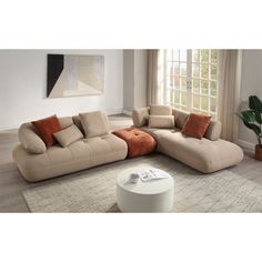 a living room with a large sectional couch and coffee table