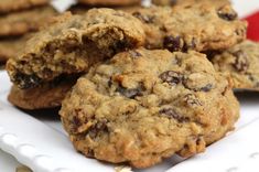 several cookies are stacked on a white plate