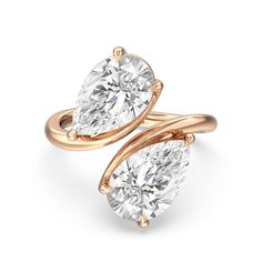 two pear shaped diamond engagement rings in yellow gold