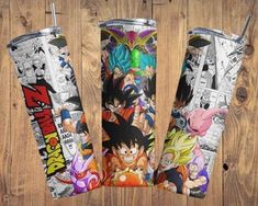 three different styles of dragon ball travel mugs on a wooden surface with the same pattern