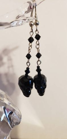 "This is a black 19mm Crystal skull dangling on a 1\" vintage Swarovski jet crystal chain. I made these earrings for those who like the dark side. For those who wish it was Halloween everyday. For someone who wants something out of the ordinary. This is what you're looking for. And of course, the 1st pair are mine." Black Skull Sterling Silver Jewelry, Black Sterling Silver Skull Jewelry, Black Single Earring For Halloween, Nickel-free Black Punk Earrings, Black Nickel-free Punk Earrings, Black Skull Earrings For Gift, Black Gothic Jewelry With Skull Print, Black Skull Print Earrings As Gift, Handmade Black Skull Earrings