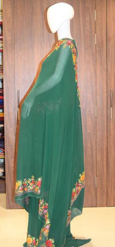 A Marvellous Embroidered Kashmiri Saree which you can wear at any party or a wedding.- - - - - - - - - - - - - - - - - - - - Product DetailsCondition: Brand NewEmbroidery: Kashmiri Aari embroideryColour: GreenF A B R I CSaree: Viscose Georgette Blouse: Indian CrepeF I N I S H- UnstitchedYou can get it stitched locally.- StitchedWant your blouse ready to wear, let us know the style you want and we will stitch it for you.***PLEASE NOTE: We would require you to share certain precise body measuremen Designer Churidar With Embroidered Border, Festive Floor-length Churidar With Embroidered Border, Festive Floor-length Embroidered Churidar, Floor-length Chanderi Churidar With Embroidered Border, Floor-length Embroidered Chanderi Churidar, Floor-length Embroidered Chanderi Dupatta, Floor-length Churidar With Embroidered Border For Navratri, Green Salwar Kameez With Floral Embroidery, Designer Anarkali Set With Embroidered Border