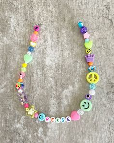 This listing is for a one of a kind fun colorful necklace with your choice of name or word. You will receive a one of a kind necklace in rainbow colors with smileys, hearts, stars, gummy bears, crowns, and other fun beads. Perfect for kids or for adults to wear! Necklace has a clasp This items is personalized and is final sale. Please familiarize yourself with my shop policies.  If shopping for a toddler or kid- 13-15 inches would be recommended for length. For adults, 14-18 inches is recommende Colorful Necklace, Colourful Necklace, Necklace Personalized, Gummy Bears, Personalized Necklace, Name Necklace, Shop Policies, Rainbow Colors, Jewelry Crafts