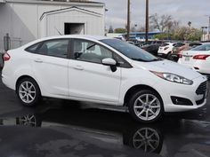 a white car parked in a parking lot