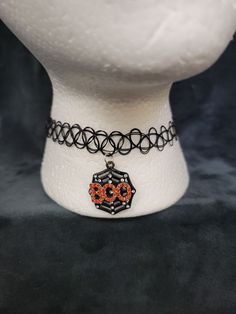 I love the aesthetic of this necklace. It is adjustable to different neck sizes. Festival Choker Necklaces With Adjustable Cord, Festival Choker Necklace With Adjustable Cord, Gothic Adjustable Necklace For Halloween, Gothic Halloween Adjustable Necklace, Gothic Round Adjustable Necklace, Gothic Adjustable Round Necklace, Handmade Choker Necklace For Halloween, Adjustable Party Necklaces, Adjustable Chain Choker For Festival