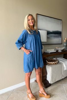 DESCRIPTION Denim mini dress featuring round neck, 3/4 sleeves, and side pockets. Button closure at back. Unlined. Non-sheer. 100% cotton. SIZING INFO S/2-4 M/6-8 L/10-12 Light Wash Denim Dress With Pockets For Daywear, Relaxed Fit Washed Dresses For Daywear, Chic 3/4 Sleeve Dress With Pockets, Chic Dress With 3/4 Sleeves And Pockets, Medium Wash Dress With Pockets And Relaxed Fit, Casual Oversized Dress With 3/4 Sleeves, Medium Wash Relaxed Fit Dress For Daywear, Relaxed Fit Denim Dress With Pockets For Day Out, Denim Blue Dresses With Pockets For Daywear