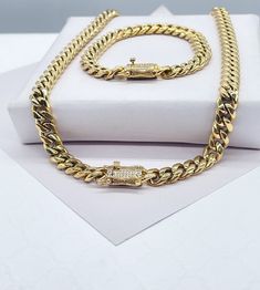 "18k Gold Filled Original 8mm Miami Cuban Link Necklace and Bracelet featuring Zirconia Box Clasp Necklace 16\" Bracelet 7\" Buy with confidence we add insurance to every shipping package. Our Etsy store was developed to help you find the most unique styles of modern designs, always looking for elegance and market trends. Here you will find ways to better make your jewelry through quality, seeking harmony, exclusivity and impeccable finish. Find many more styles in our Milie Jewelry Etsy Store. Miami Cuban Link Bracelet, Iphone Storage, Cuban Link Necklace, Miami Cuban Link Chain, Miami Cuban Link, Miami Cuban, Box Clasp, Market Trends, Necklace And Bracelet