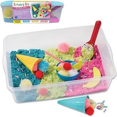 a plastic container filled with ice cream and toppings