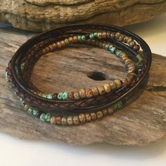 This stunning Boho wrap is made with all natural, genuine materials! Genuine Antique Brown braided leather with high quality Miyuki seed beads in colors of Beige, Brown and seafoam green! This is made to wrap around your wrist twice and encloses with a lobster clasp. **If you are purchasing more than one bracelet, please specify in the note area the size wanted for each bracelet. Thanks! You can have one made for her and him! Your beaded wrap will come packaged in a gorgeous gift bag and box! Si Brown Wrap Bracelet With Colorful Beads For Festival, Bohemian Bracelets With Waxed Cord And Round Beads, Bohemian Hand Wrapped Beaded Bracelets On Waxed Cord, Bohemian Bracelets With Round Beads And Waxed Cord, Hand Wrapped Waxed Cord Bracelets With Round Beads, Bohemian Beaded Bracelets With Waxed Cord For Festivals, Braided Waxed Cord Bracelets With Round Beads For Festival, Bohemian Brown Bracelet With 108 Beads, Artisan Hand Wrapped Leather Bracelet For Festivals