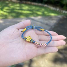 Embrace the beauty of friendship with our adjustable braided bracelet, featuring beaded sakura flowers woven into the design. 🌸 This charming piece serves as a perfect symbol of connection and camaraderie, making it an ideal friendship bracelet. 💕 The adjustable fit ensures it will comfortably suit any wrist size, and the sakura flowers add a touch of elegance and femininity. 🌟 Whether you're celebrating a special bond or just love the delicate beauty of sakura flowers, this bracelet is a perfect choice. Show your friends how much they mean to you, or treat yourself to this lovely accessory. #BraidedBracelet #BeadedSakura #FriendshipBracelet #AdjustableBracelet #EtsyJewelry Flower Shaped Jewelry With Adjustable Cord As A Gift, Flower-shaped Jewelry With Adjustable Cord For Gifts, Casual Braided Beaded Bracelets As Gift, Casual Braided Beaded Bracelets For Gift, Adjustable Flower Bracelets As Gift For Her, Adjustable Flower Bracelet As A Gift For Her, Adjustable Flower Bracelet Gift For Her, Handmade Braided Bracelets For Spring Gift, Spring Gift Adjustable Braided Bracelets