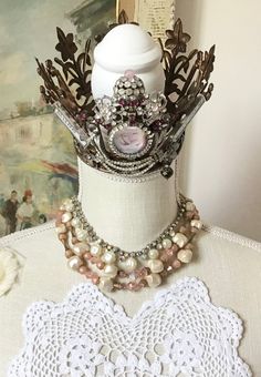 Vintage lot of 3, sold together only. 2 bead necklaces from the 50s and one pair of clip earrings. First necklace is a beautiful pink and dusty pink purple two-strand necklace with aurora borealis pink and textured creamy satin white faux pearls. Hook closure. 15-16 inches. Second necklace is a sparkly aurora borealis rhinestone and dimpled faux pearl necklace. About 15 inches. Clip earrings measure 1.5 inches long, made of elegant grayish purplish faux pearls and shimmering aurora borealis. Wea Vintage Jewelry With Bead Caps And Round Beads, Vintage Jewelry Bead Caps For Jewelry Making, Whimsical Beaded Jewelry For Wedding, Victorian Beaded Jewelry For Vintage Events, Vintage Pink Beaded Necklace As A Gift, Vintage Pink Jeweled Necklace, Vintage Pink Beaded Necklaces, Vintage Beaded Jewelry For Events, Vintage Pink Beaded Jewelry